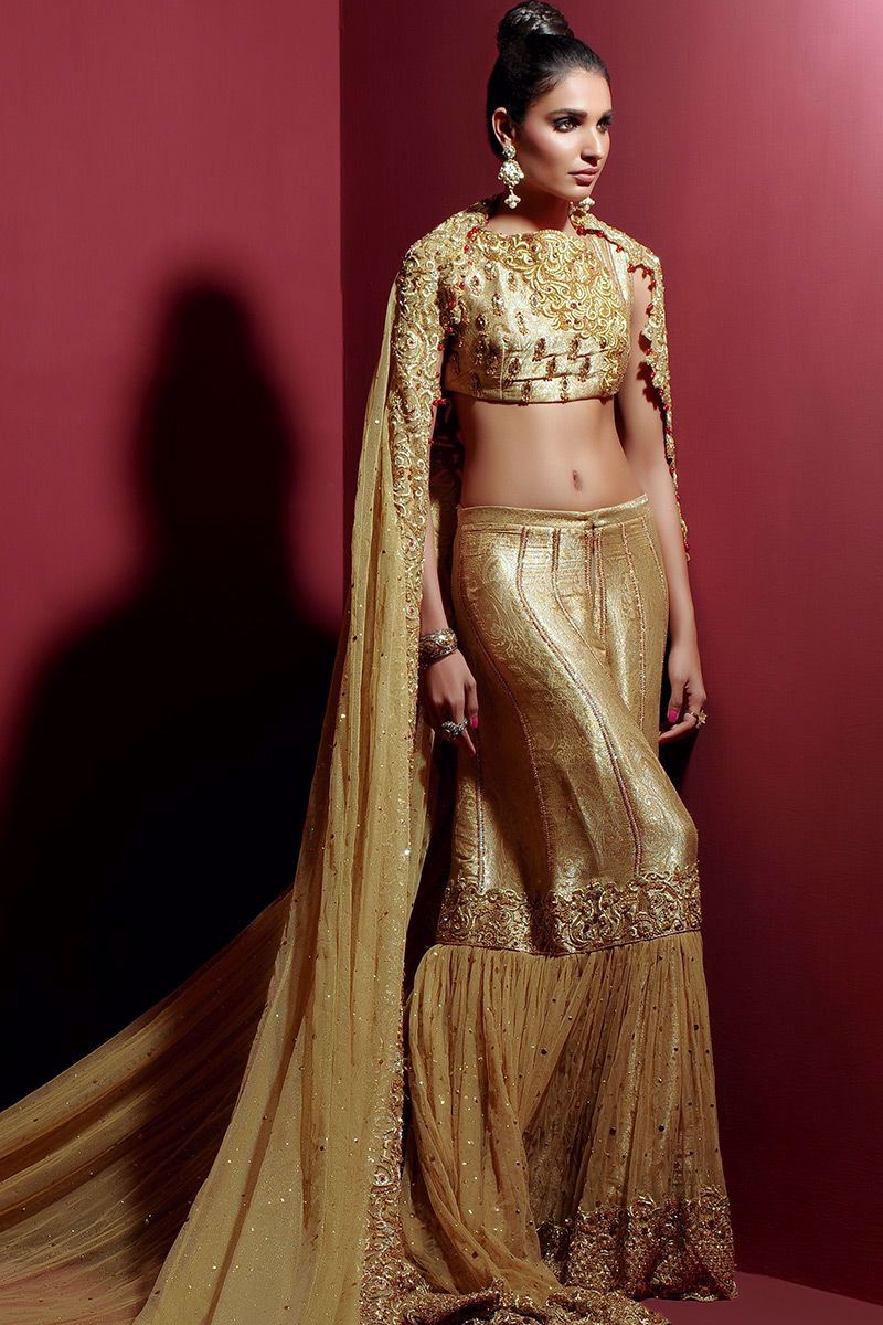 Picture of Gold choli with gharara and grand veil